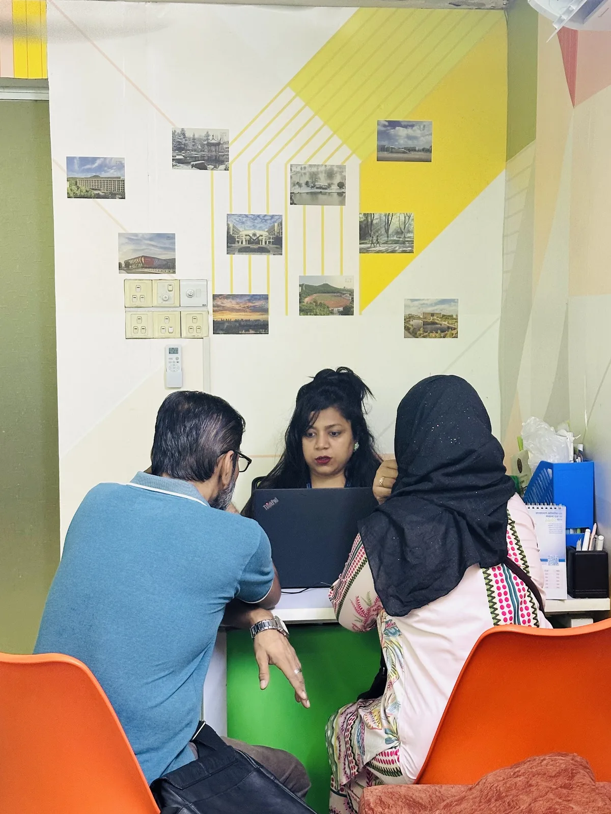 An EduExpress counsellor meeting a student and parent in the Dhanmondi office
